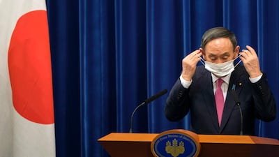 Japan's Prime Minister Yoshihide Suga is under pressure for a variety of reasons. AP Photo