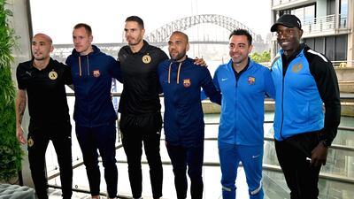 L-R: Jack Rodwell, Marc-Andre ter Stegen, Jason Davison, Dani Alves, Xavi Hernandez and Dwight Yorke pose for a group picture after a press conference in Sydney. AFP
