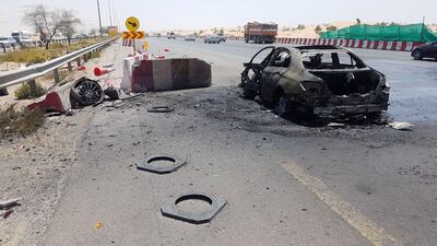 The burnt out vehicle on Emirates Road. Courtesy Dubai Police