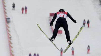 Espen Andersen, of Norway, soars through the air during the trial jump in the nordic combined competition at the 2018 Winter Olympics in Pyeongchang. Kirsty Wigglesworth / AP Photo