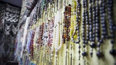 Prayer beads come in many different colours, with prices ranging from a few hundred dirhams to thousands. Razan Alzayani / The National