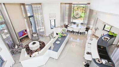 The traditional Portuguese exterior moves into a modern and simple interior with open-plan, spacious rooms. Courtesy Kensington Exclusive Properties