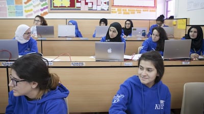 Seniors from Al Mawakeb school in Dubai during a maths class. Reem Falaknaz / The National