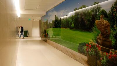A corridor in the Consular section with a photograph of the Winfield House garden, the official residence of the United States ambassador to the UK, in the new United States Embassy building in central London. Alastair Grant / AFP