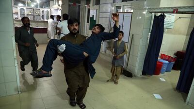An Afghan man who was injured when militants attacked central prison, is shifted to a hospital in Jalalabad, Afghanistan. EPA