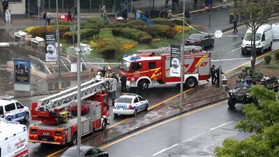 Turkish police and emergency services respond to the bombing in Ankara on October 1. EPA