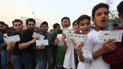 Pakistan fans wait for the opening match of PSL in Karachi on Thursday. AP