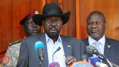 South Sudan's President Kiir flanked by former rebel leader Riek Machar address a news conference at the State House in Juba. Reuters