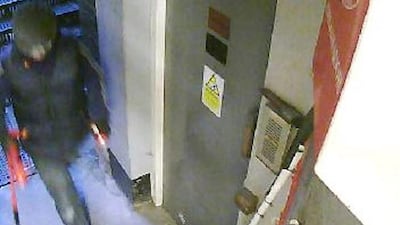 A handout CCTV still image released by the Metropolitan Police Service on April 11, 2015 shows a suspect during the burglary at Hatton Garden Safety Deposit Limited in London. Thieves raided some 300 deposit boxes in London’s diamond quarter, accessing a vault through a lift shaft and using heavy cutting equipment. Courtesy MPS