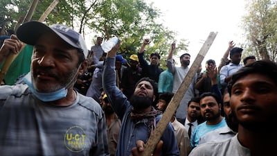 Supporters of former Pakistani prime minister Imran Khan outside his house in Lahore on Wednesday. Reuters
