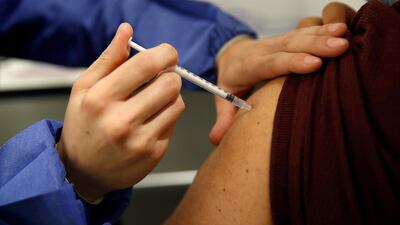 File photo: A medical worker administers a dose of the "Comirnaty" Pfizer-BioNTech Covid-19 vaccine in a vaccination centre in Paris. Reuters