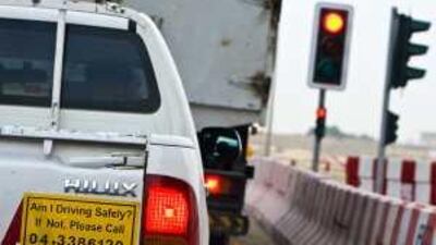A commercial vehicle displays a telephone number for motorists to report on the driver. The National found that most of the companies it called were unresponsive or were unhelpful.