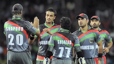 Izatullah Dawlatzai, second from left, was in brilliant form when Afghanistan played England at the World Twenty20 in 2012, in Colombo. AFP