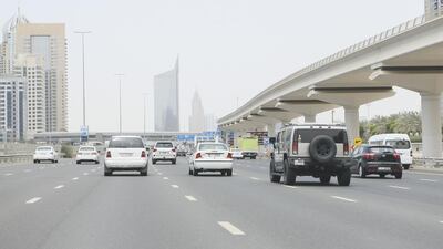 A number of SUVs make their way along the Sheikh Zayed Road in Dubai. Sarah Dea / The National