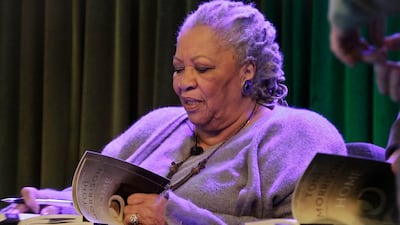 Toni Morrison signs copies of her book 'Home,' during Google's online program series, Authors At Google, in New York, in 2013. AP Photo