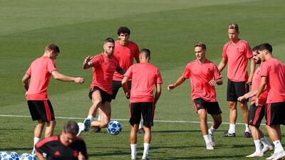 Sergio Ramos, second left, goes for the ball during a training session in Madrid. AP Photo