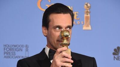 Jon Hamm poses with his award for Best Actor in a Television Series — Drama for his role in Mad Men, in the press room at the 73rd annual Golden Globe Awards. Frederic J Brown / AFP photo