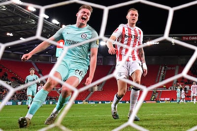 Brighton's Irish striker Evan Ferguson, left, celebrates after scoring against Stoke City. AFP