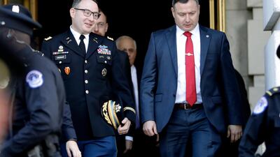 Lt Col Alexander Vindman, a decorated Iraq war veteran, and his twin brother, Lt Col Yevgeny Vindman, were both marched out of the White House. AP Photo