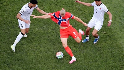 Norway's Erling Haaland in action with Iraq's Hussein Ali and Zaid Tahseen in Boston. Reuters