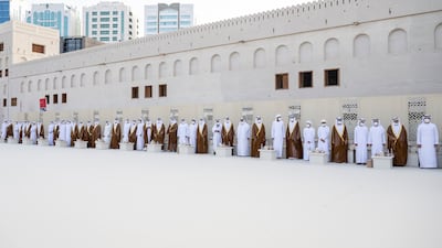 Grooms participate in the group wedding reception.