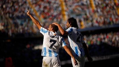 Malaga's Joaquin Sanchez (L) celebrates with teammate Sergio Sanchez after scoring a goal against Levante during their Spanish First Division soccer match at La Rosaleda stadium in Malaga, southern Spain September 15, 2012. REUTERS/Jon Nazca (SPAIN - Tags: SPORT SOCCER)