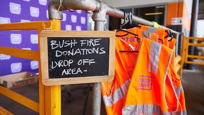 A sign shows the public where to unload donated goods at the Food Bank Distribution Centre bound for areas impacted by bushfires in the Glendenning suburb of Sydney, Australia. Getty Images