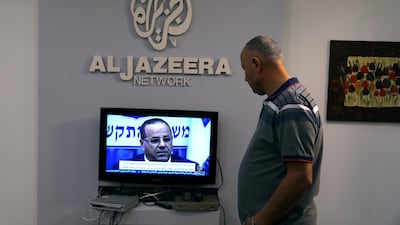 An employee working inside the office of Qatar-based Al-Jazeera network in Jerusalem August 7, 2017. REUTERS/Ammar Awad