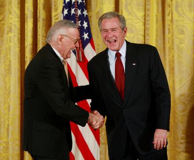 President George W Bush shares a light moment with Stan Lee as Lee is presented with a National Medal of Arts in 2008. Reuters