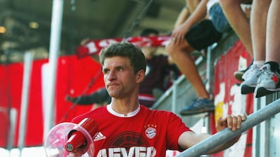 Bayern Munich's Thomas Muller celebrates with fans after their victory to secure the Bundesliga title on Saturday at Ingolstadt. Alex Grimm / Bongarts / Getty Images / May 7, 2016