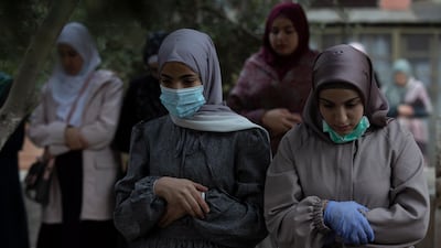 Palestinian Muslims attend Eid prayers next to the closed gates of Al Aqsa mosque, in Jerusalem's old city. EPA