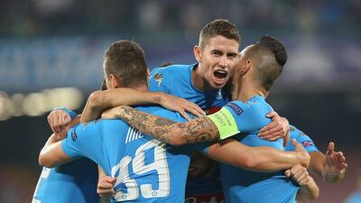 Napoli players celebrate during their Champions League win over Benfica on Wednesday night. Maurizio Lagana / Getty Images