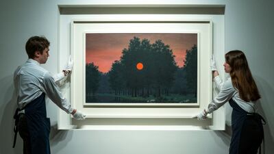 Handlers place 'Le Banquet' by Magritte during a media preview for Sotheby's upcoming New York Marquee Evening Sales'. Reuters