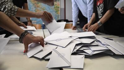 Greek election officials count ballots in Thessaloniki. AFP