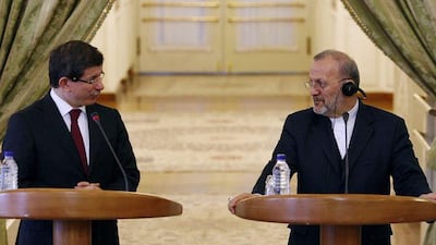 Ahmet Davutoglu, Turkey's foreign minister, left, with his Iranian counterpart, Manouchehr Mottaki, in Tehran.