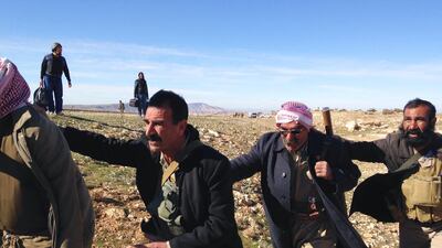Refugees and fighters board an Iraqi Army helicopter in Sinjar, Iraq. Jonathan Krohn for The National