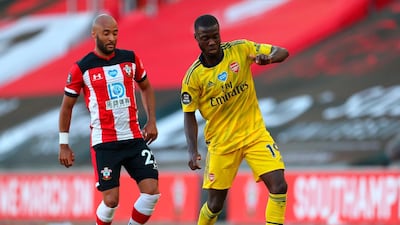 Arsenal's Nicolas Pepe in action against Southampton's Nathan Redmond. EPA