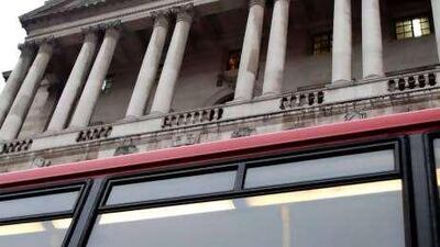 A London bus advertisement provides some good advice for UK homeowners as it passes by the Bank of England, which has held the base rate at 0.5 per cent for the past 18 months.