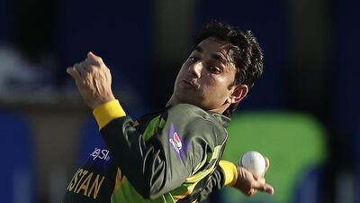 Pakistan’s Saeed Ajmal pitches a delivery during the first one-day international cricket match between Pakistan and South Africa at the Sharjah Cricket Stadium in Sharjah, United Arab Emirates, Wednesday, Oct. 30, 2013. (AP Photo/Hassan Ammar)