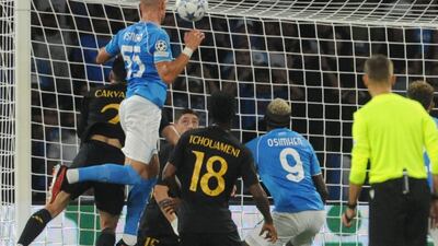 Napoli's defender Leo Ostigard scores the opener. EPA