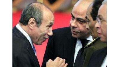 Habib el Adly, left, the former Egyptian interior minister, is . (AP Photo/Amr Nabil, File)