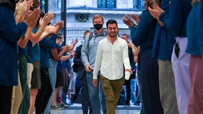The first customers on Friday to enter the Apple Store in Regent Street, central London, received a round of applause as the new Apple iPhone 13 went on sale in the UK. PA