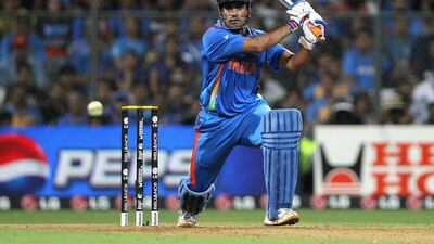 MS Dhoni of India drives during the 2011 ICC World Cup Final. Getty Images