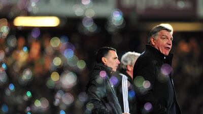 West Ham United manager Sam Allardyce, right, says the negative reaction from fans is due to the team overachieving last season and having unrealistic expectations for this season. Glyn Kirk / AFP