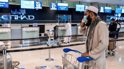 Passengers at the Etihad check-in desk
