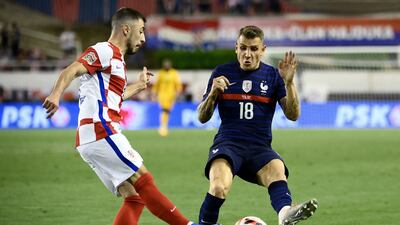 France defender Lucas Digne fights for the ball with Croatia defender Josip Juranovic. AFP