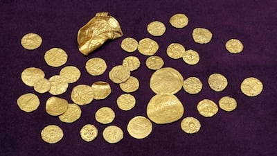 Gold coins, along with four other gold objects, unearthed by the metal detectorists, comprising the largest such Anglo-Saxon hoard to be found in England. PA