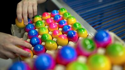 A worker packs eggs after they are coloured for Easter at Baumeister Frischei egg and chicken farm in Breckerfeld, Germany. The farm is among the biggest egg producers in the region, producing 120,000 chicken eggs daily to meet demand for its brightly-coloured eggs two weeks before Easter. Sascha Schuermann/ Getty Images