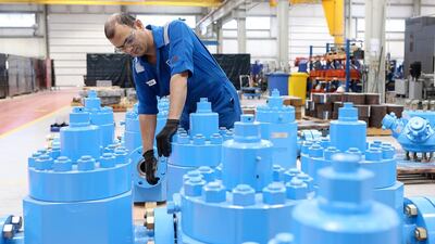 A staff checks valves and manifolds being manufactured at the Weir Group plant. Pawan Singh / The National