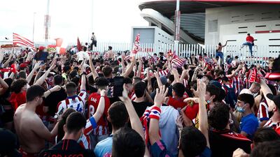 Atletico Madrid fans celebrate outside the stadium after the match. Reuters